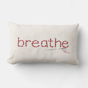 red Breathe text stitch with needle Lumbar Pillow