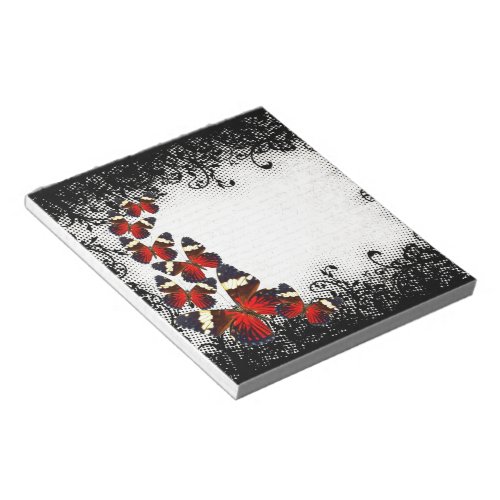 Red butterflies on black lace notepad