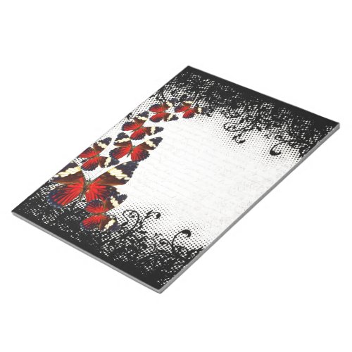 Red butterflies on black lace notepad