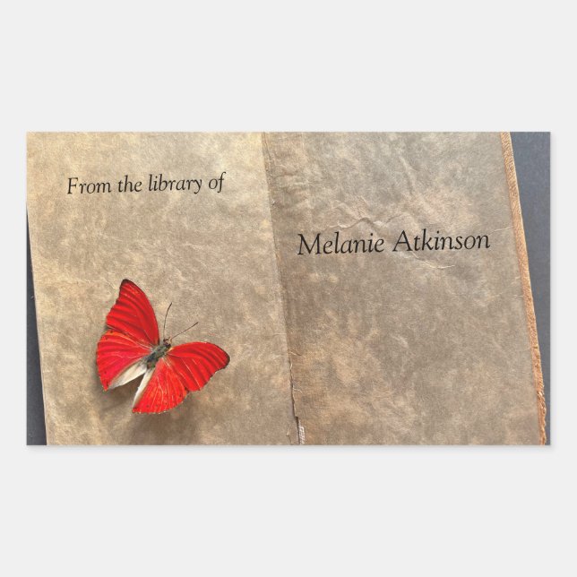 Red butterfly on vintage book pages rectangular sticker (Front)