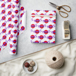 red button with purple bow wrapping paper