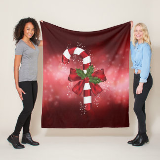 Red Candy Cane On A Red Bokeh Background Fleece Blanket
