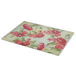Red Carnations on green with butterflies Cutting Board