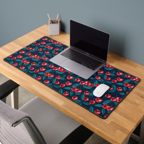 Red cherries on dark blue wrapping paper desk mat