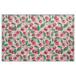 Red cherries on pink gingham fabric