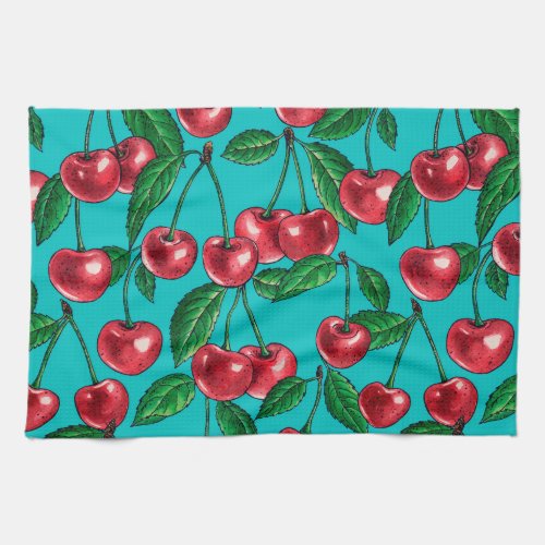 Red cherries on turquoise kitchen towel