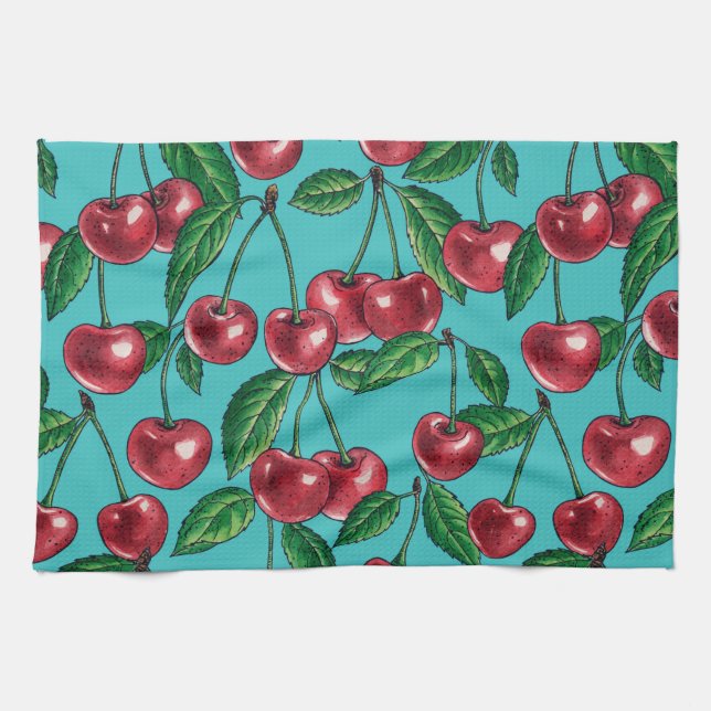 Red cherries on turquoise kitchen towel (Horizontal)
