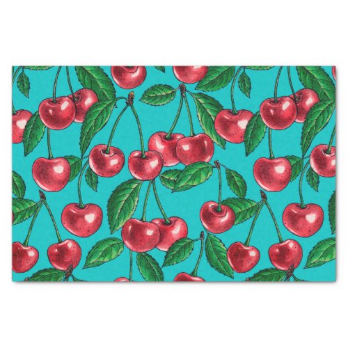 Red cherries on turquoise tissue paper