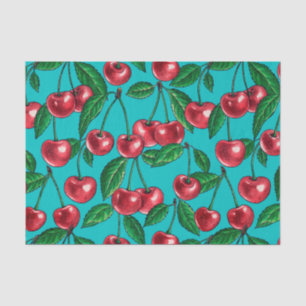 Red cherries on turquoise tissue paper