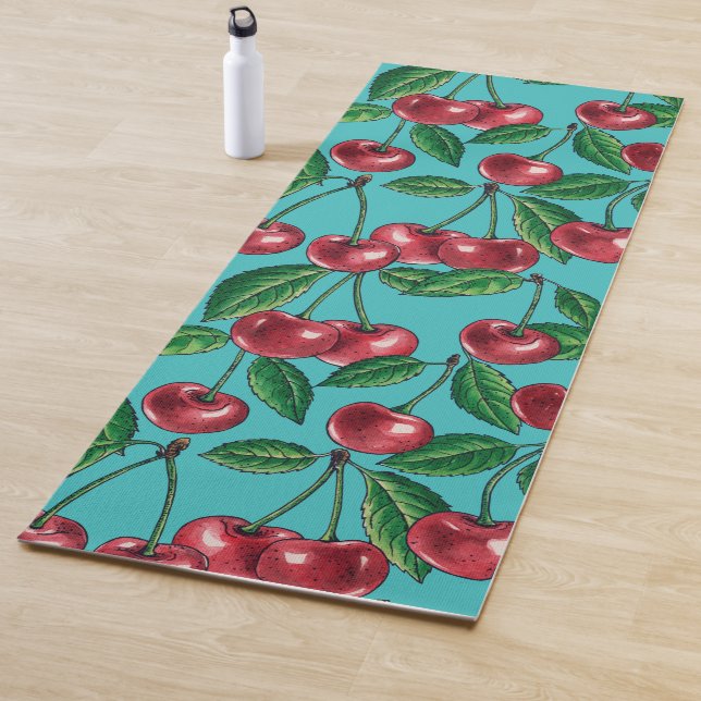 Red cherries on turquoise yoga mat (In Situ)