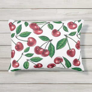 Red cherries on white outdoor pillow
