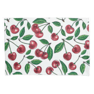 Red cherries on white pillow case
