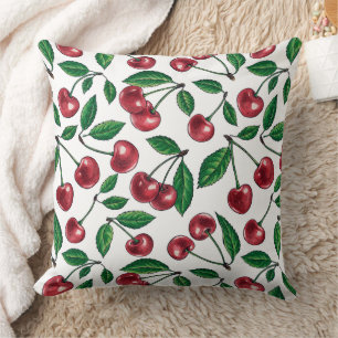 Red cherries on white throw pillow