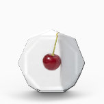 Red Cherry Berry Acrylic Award<br><div class="desc">Red cherry hangs from the brim of the gray porcelain cup against white background. The summertime theme</div>