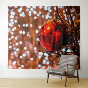 Red Christmas ball, brown bacground, white lights Tapestry