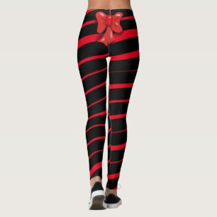 RED CHRISTMAS RIBBON AND BOW ON BLACK LEGGINGS