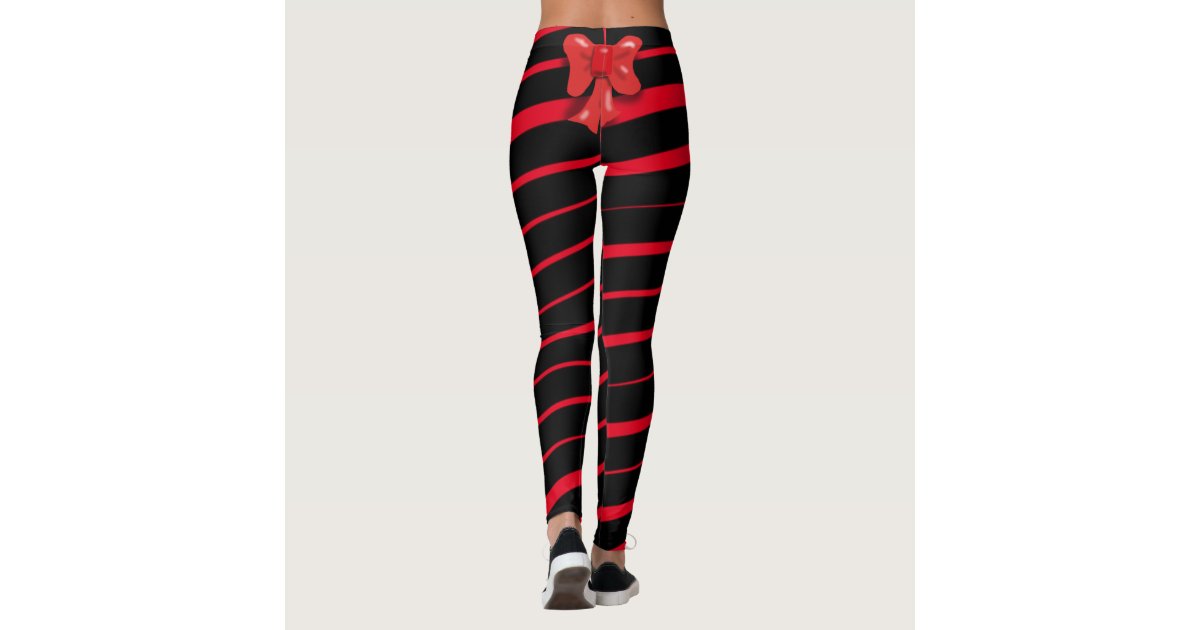 RED CHRISTMAS RIBBON AND BOW ON BLACK LEGGINGS