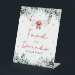 Red Christmas Santa Baby Shower Food and Drinks Pedestal Sign<br><div class="desc">The Red Santa Gender Neutral Santa Baby Clothes Christmas Red Christmas Santa Baby Shower Food and Drinks sign adds a festive and inviting touch to your holiday-themed baby shower. Featuring a cheerful red design with delicate snowflakes, seasonal eucalyptus greenery, and adorable Santa-inspired baby clothes, this sign warmly directs guests to...</div>