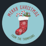 Red Christmas Stocking On Blue With Custom Text Classic Round Sticker<br><div class="desc">Destei's original illustration of a festive red Christmas stocking that has two candy canes coming out of it. The background color is blue. There are also two personalizable text areas.</div>