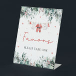 Red Christmas Winter Cute Santa Baby Shower Favors Pedestal Sign<br><div class="desc">The Red Santa Gender Neutral Santa Baby Clothes Christmas Winter Cute Santa Baby Shower Favors Sign is a festive and charming addition to your holiday-themed baby shower. Featuring a cheerful red design with delicate snowflakes, eucalyptus greenery, and adorable Santa-themed baby clothes, this sign directs guests to the favor table with...</div>