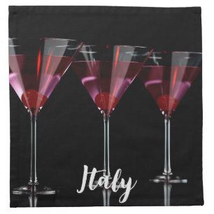 Red cocktails in martini glass with cherry cloth napkin