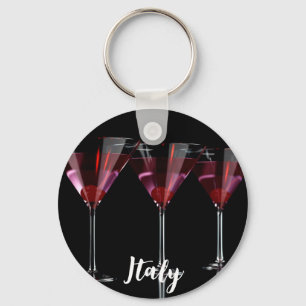 Red cocktails in martini glass with cherry keychain