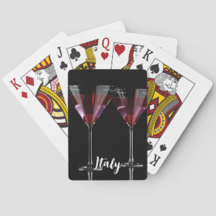 Red cocktails in martini glass with cherry poker cards