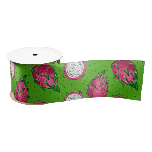 Red dragon fruit on green satin ribbon