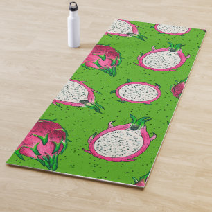 Red dragon fruit on green yoga mat