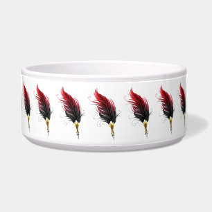 Red feather pen with gold nib bowl
