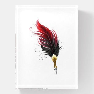 Red feather pen with gold nib paperweight