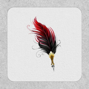 Red feather pen with gold nib patch