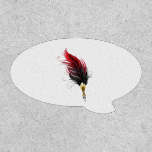 Red feather pen with gold nib patch