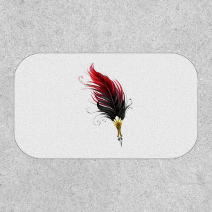 Red feather pen with gold nib patch