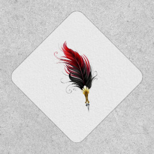 Red feather pen with gold nib patch