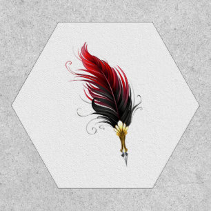 Red feather pen with gold nib patch