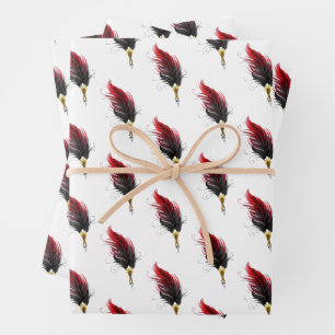 Red feather pen with gold nib wrapping paper sheets