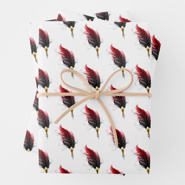 Red feather pen with gold nib wrapping paper sheets (In situ)