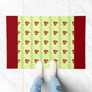 Red Floral Vine Pattern on Light Green Doormat