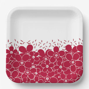 Red flowers daisies on white background paper plates