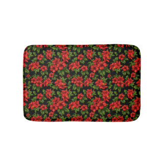 Red flowers on the black background bath mat