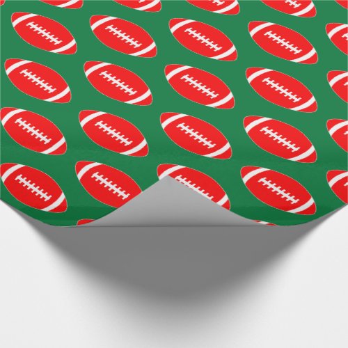 Red Footballs on Green Background Christmas Gift Wrapping Paper