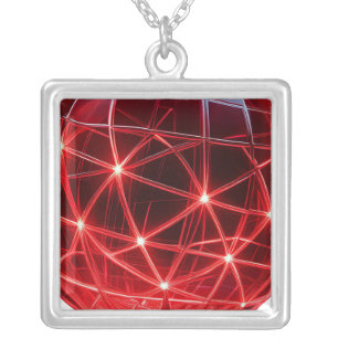 Red Glass Globe On Pedestal With Intersecting Line Silver Plated Necklace