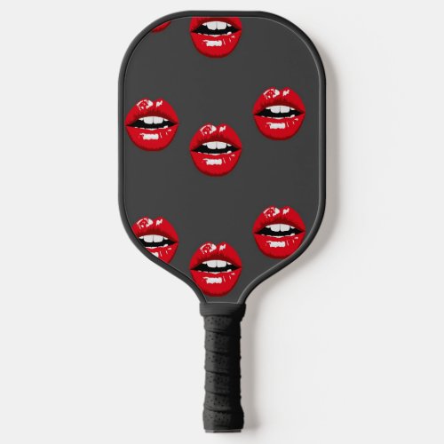 Red glossy lips on gray pickleball paddle