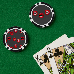 Red glossy lips on gray poker chips