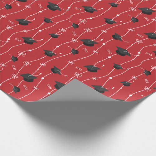 Red Graduation Caps and Ribbon Wrapping Paper