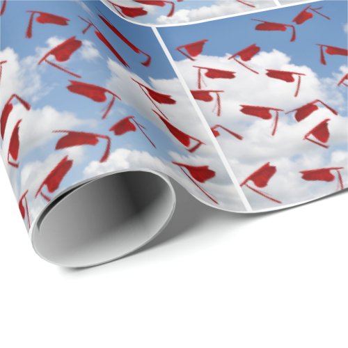 Red graduations hats in sky wrapping paper
