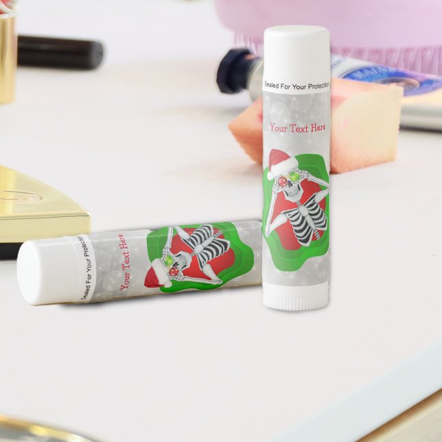 Red Green Splatter Christmas Skeleton White Circle Lip Balm (Fun Christmas skeleton ornament eyes green red splatter shape on white circles on tube lip balm.)