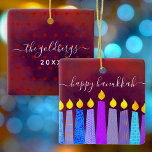 Red Hanukkah Menorah Candles Script Name Keepsake Ceramic Ornament<br><div class="desc">“Happy Hanukkah.” A playful, modern, artsy illustration of boho pattern candles helps you usher in the holiday of Hanukkah in style. Assorted blue candles with colorful faux foil patterns overlay a rich, deep burnt red orange textured background. On the back, personalize with your family name and year, over a tiny...</div>