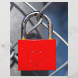 Red heart lock on fence